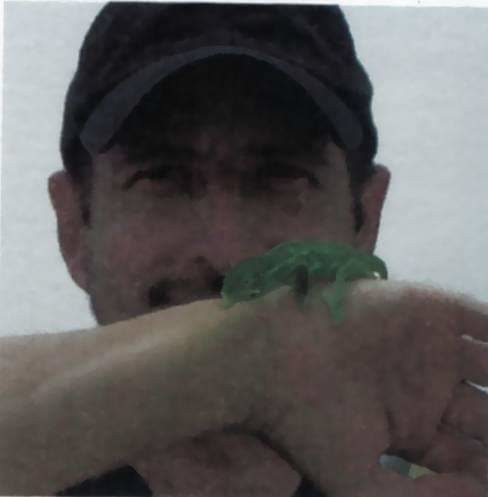 Pulitzer winner rescues baby iguana at Darfur refugee camp Journalist Mark Fritz rescues a lizard in Darfur in 2009